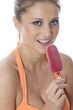 Model Released. Young Woman Eating Ice Lolly