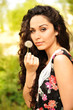 Photo: Portrait of young beautiful woman with a dandelion Portrait of young beautiful woman with a dandelion