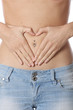 Model Released. Healthy Fit Young Woman Heart Shape on Tummy