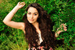 Photo: Young beautiful woman in a grass Young beautiful woman in a grass