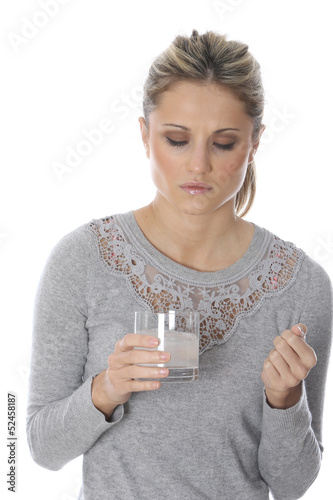 Photo: Model Released. Young Woman Taking Medicine Model Released. Young Woman Taking Medicine