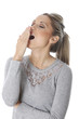 Model Released. Tired Young Woman Yawning