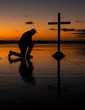 Kneeling Before The Cross