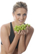 Foto: Model Released. Young Woman Holding a Bunch of Grapes Model Released. Young Woman Holding a Bunch of Grapes