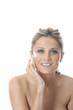 Model Released. Young Woman Applying Cream