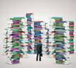man looking at books