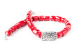 Handmade necklace with red gemstone beads on white background
