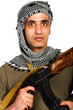 Terrorist with automatic gun and launcher on white background
