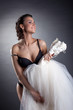 Portrait of cheerful bride posing naked in studio