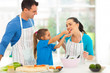 Photo: loving daughter feeding mother a piece of tomato loving daughter feeding mother a piece of tomato