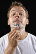 Man shaving chin