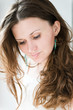 Photo: Portrait of beautiful young happy smiling woman with long curly Portrait of beautiful young happy smiling woman with long curly
