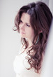 Photo: Portrait of beautiful young happy smiling woman with long curly Portrait of beautiful young happy smiling woman with long curly