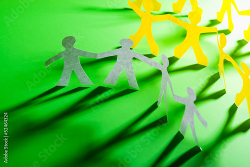 Photo: Paper people in teamworking concept Paper people in teamworking concept