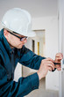 electrician with screwdriver