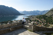 man looking at the view at the straight of kotor, montenegro