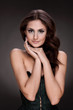 Beautiful brunette woman on grey background