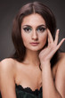 Beautiful brunette woman on grey background