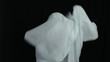 Mad man in sheet, over dark background