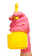 Hand in a pink glove holding spray bottle