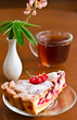 Closeup of cup of tea with cake
