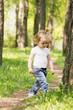 Little girl walking in park