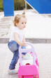 Little girl with toy car