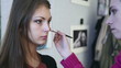 Video: Making up the model for photo session in studio. Making up the model for photo session in studio.