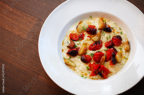Photo: Creamy risotto with roasted cherry tomatoes and garlic Creamy risotto with roasted cherry tomatoes and garlic