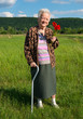 Old woman with bunch of poppy flowers