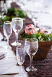 Photo: Wine and champagne glasses on a table with protea flowers Wine and champagne glasses on a table with protea flowers