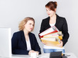 Two female office assistants have to much work