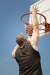 Foto: Basketball player throw the ball through the basket Basketball player throw the ball through the basket