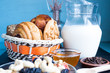 carafe of milk with baked peanut butter cookies