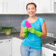 woman cleans the kitchen