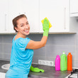 woman cleans the kitchen