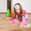 little girl cleans the house