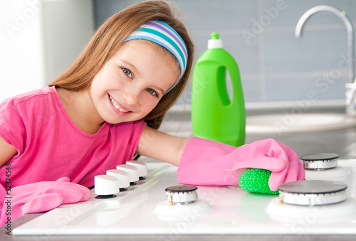 Photo: girl make cleaning in the kitchen girl make cleaning in the kitchen