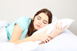 Beautiful young woman sleeping in bed