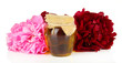 Jar of honey, honeycombs with flowers of peony, isolated