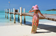 Photo: Girl at the wooden jetty looking to the ocean. Exuma, Bahamas Girl at the wooden jetty looking to the ocean. Exuma, Bahamas