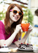 Photo: Style redhead girl with cup and cake Style redhead girl with cup and cake