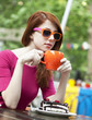 Photo: Style redhead girl with cup and cake Style redhead girl with cup and cake