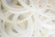 Onion rings on white background