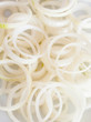 Onion rings on white background
