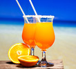 Tequila Sunrise Cocktail on wooden planks