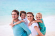 Foto: Family on a tropical beach vacation Family on a tropical beach vacation