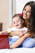 mother and son are using laptop