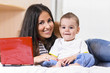 mother and son are using laptop