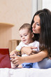 mother and son are using laptop